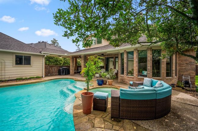 The trees and shrubs offer shade on those long summer days, where you want to be at the pool relaxing. | Image 39
