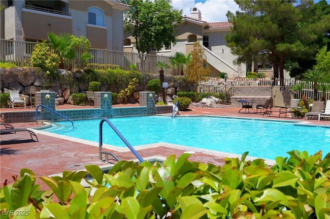 Community pool with a patio area | Image 20