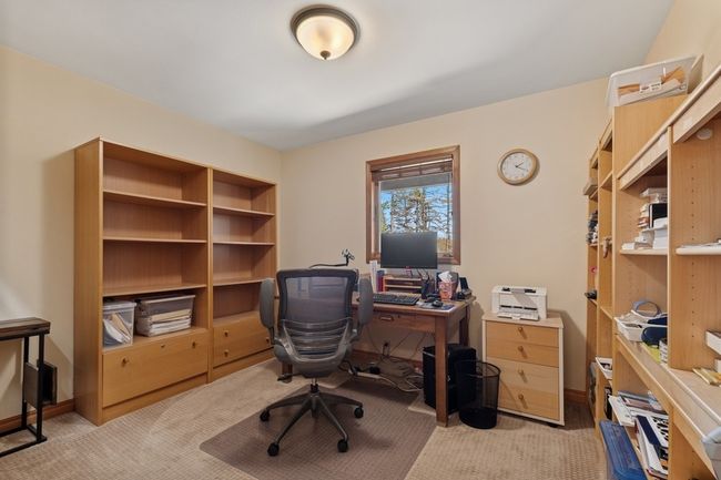 Bedroom currently being used as an office. Locatedon the main level. | Image 55