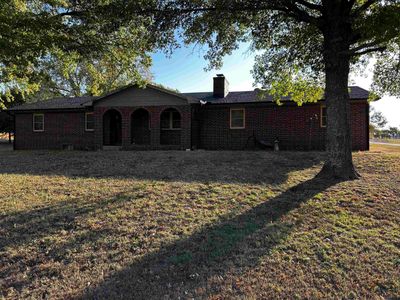 View of front facade with a front yard | Image 1