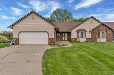 6009 Oak Creek Drive, Home with 2 bedrooms, 2 bathrooms and null parking in Mundy Twp MI | Image 1