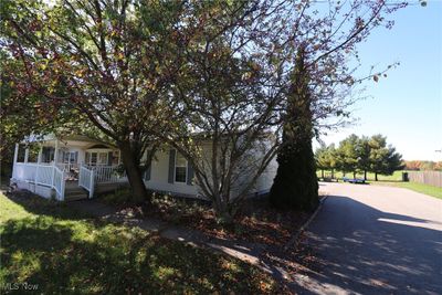 Wide blacktopped driveway | Image 3