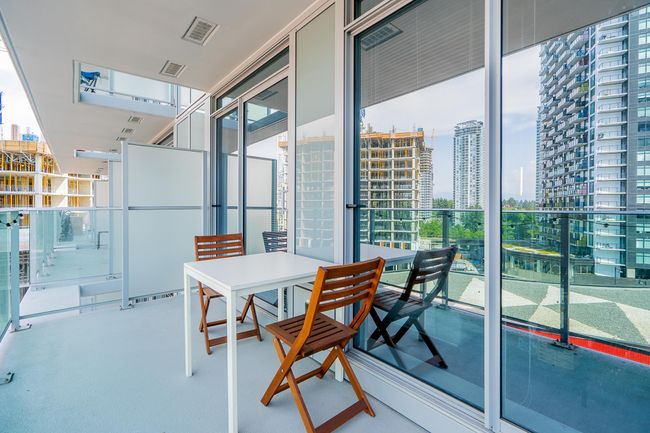 Balcony featuring visible vents and a view of city | Image 18