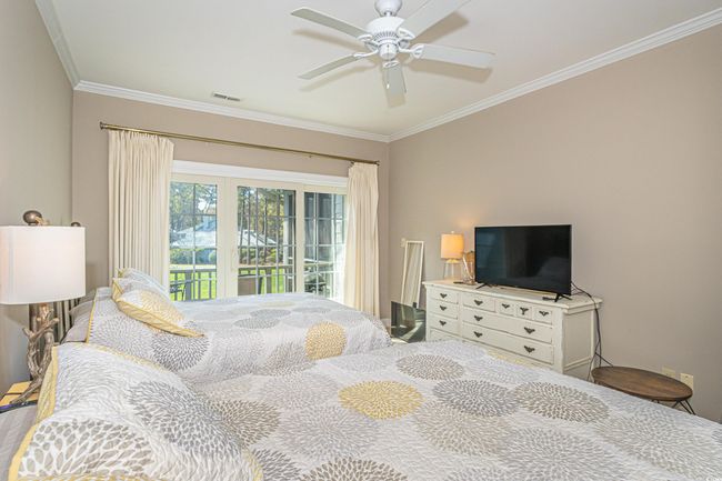Bedroom with visible vents, a ceiling fan, access to outside, and crown molding | Image 23