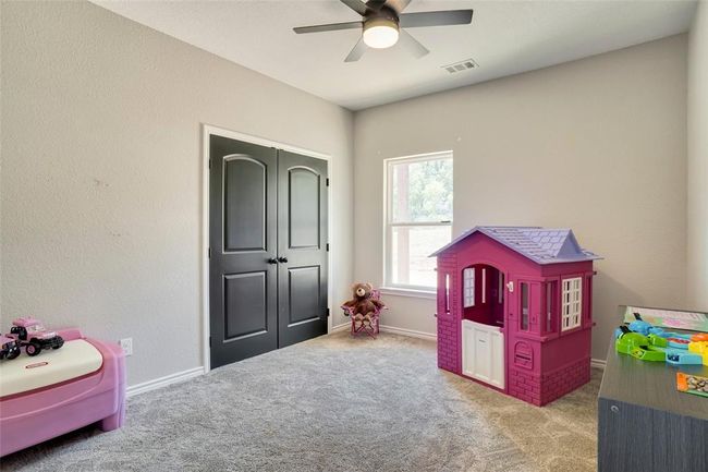 Recreation room featuring ceiling fan and carpet floors | Image 28