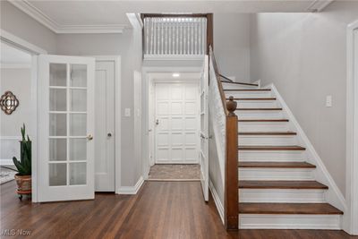 Staircase featuring crown molding and hardwood / wood-style flooring | Image 3