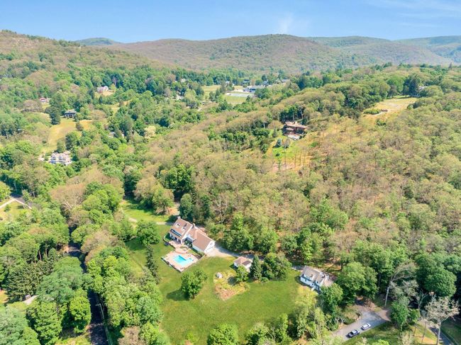 Birds eye view of property with a view of trees and a mountain view | Image 48
