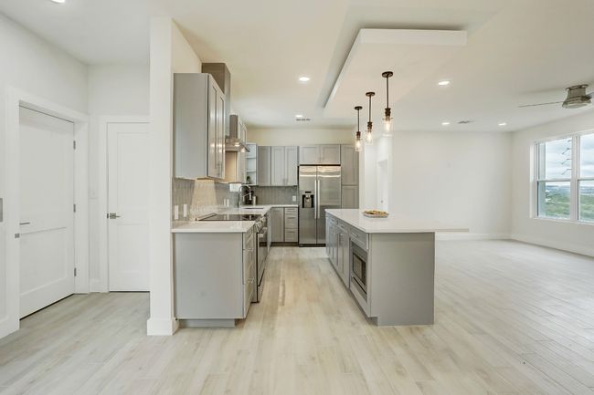 Elevator comes into the the left side of the kitchen in floor plan A. | Image 32