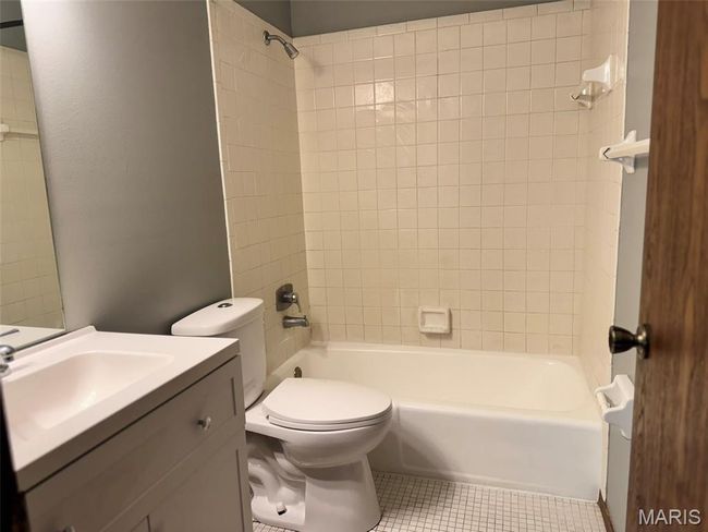 Bathroom with vanity, shower combination, and tile patterned floors | Image 8