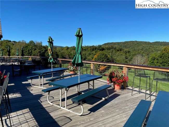 The Sugar Mountain clubhouse provides outdoor seating overlooking the golf course. | Image 46