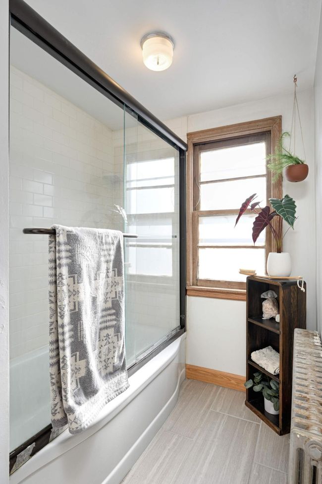 Fully renovated, this bathroom is a calming space to get ready for your day. | Image 26