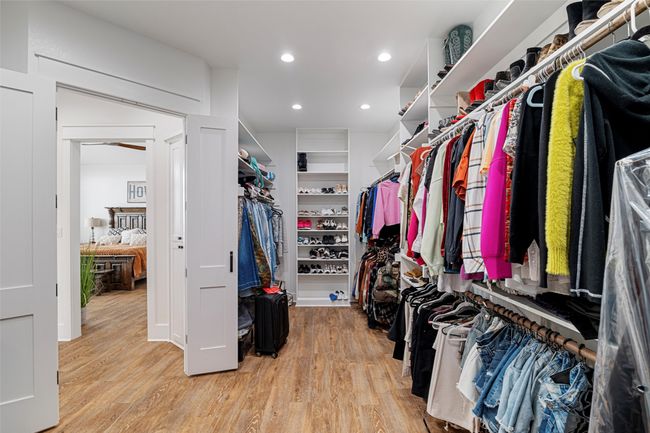 Spacious closet featuring wood finished floors | Image 10