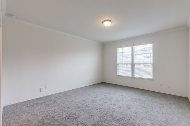 Empty room featuring carpet flooring, baseboards, and ornamental molding | Image 14