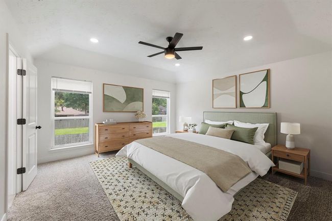 Escape to your tranquil primary suite on the second floor. Spacious primary flooded with natural light, high vaulted ceilings, and plush carpet. | Image 15