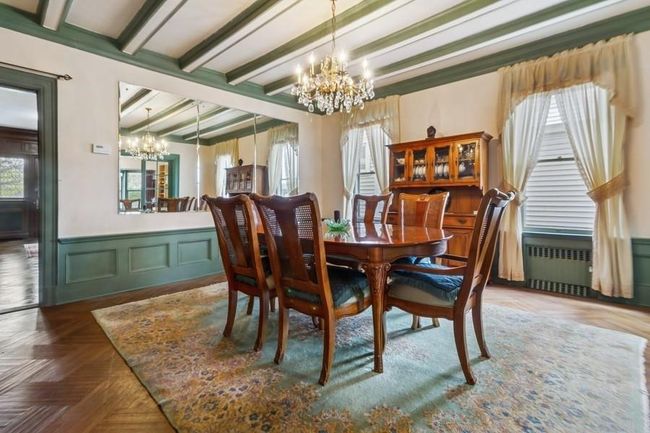 Dining room with wainscoting, & beamed ceiling beamed ceiling | Image 11