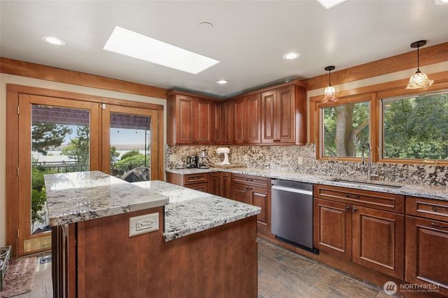 Soft close cabinets and pull-out drawers. All appliances are included. They are stainless steel Tuscan Custom appliances. | Image 9