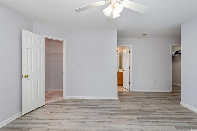 Bathroom featuring double vanity, a stall shower, and a bath | Image 16