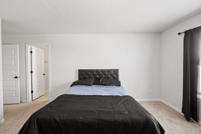 Bedroom featuring carpet flooring and baseboards | Image 21