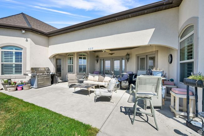 View of patio / terrace featuring ceiling fan, an outdoor hangout area, french doors, and a grill | Image 5