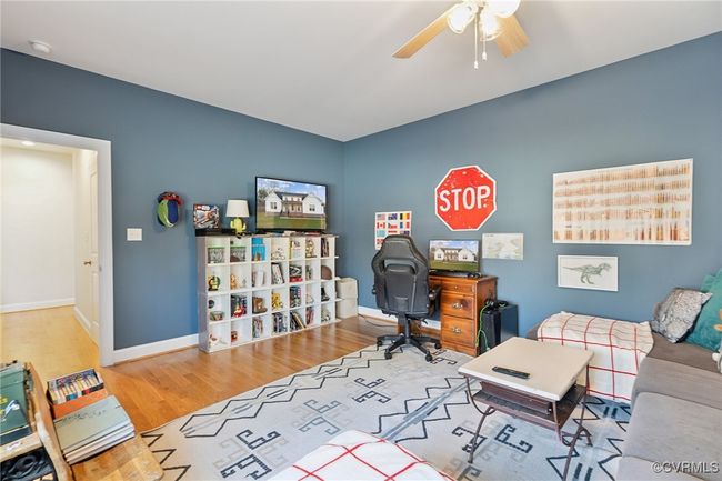 Office area with baseboards, wood finished floors, and a ceiling fan | Image 29