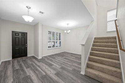 Foyer entrance with flex space for formal sitting or formal dining area with plantation shutters | Image 3