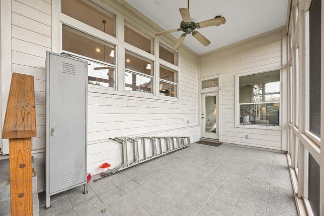 Screened porch located below the kitchen on the same level as the master bedroom. | Image 32