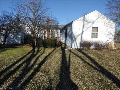 View of side of home with a lawn | Image 3