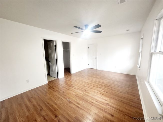 Spare room with hardwood / wood-style flooring, plenty of natural light, and ceiling fan | Image 7