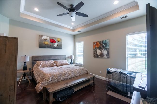 Bedroom with ornamental molding, a raised ceiling, baseboards, recessed lighting, and ceiling fan | Image 18