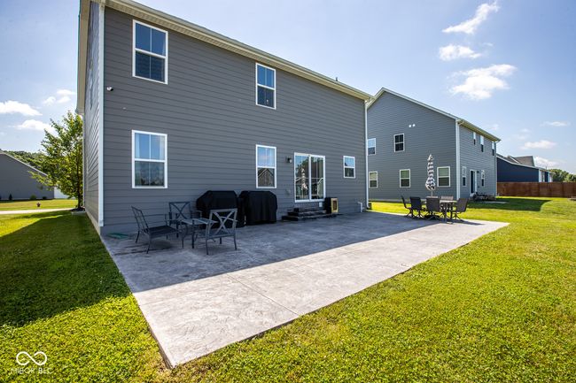 Expansive stamped paver patio excellent for grilling and gathering | Image 30