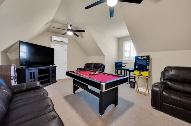 Rec room featuring ceiling fan, carpet, vaulted ceiling, and billiards table | Image 15