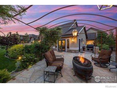 Spacious patio with metal trellis and water fountain feels like your own vineyard | Image 3