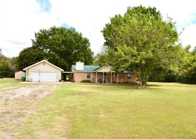 View of yard featuring a garage | Image 2