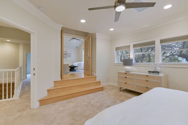 Second-floor primary bedroom with natural light, recessed lighting and carpet. Don't miss the versatile bonus room—ideal for work, relaxation, or exercise | Image 17