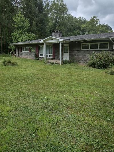 Ranch-style house with a front lawn | Image 1