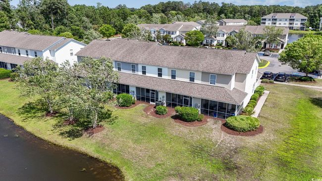 Aerial view of residential area with a nearby body of water | Image 27
