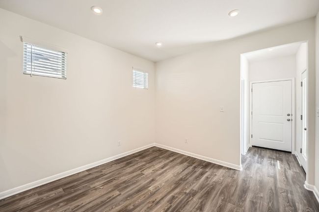Unfurnished room with dark wood-style floors, recessed lighting, and baseboards | Image 8