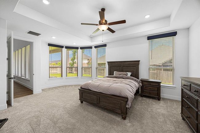 Primary bedroom located at the rear of the home for added privacy. Large double paned windows give so much natural light. | Image 30