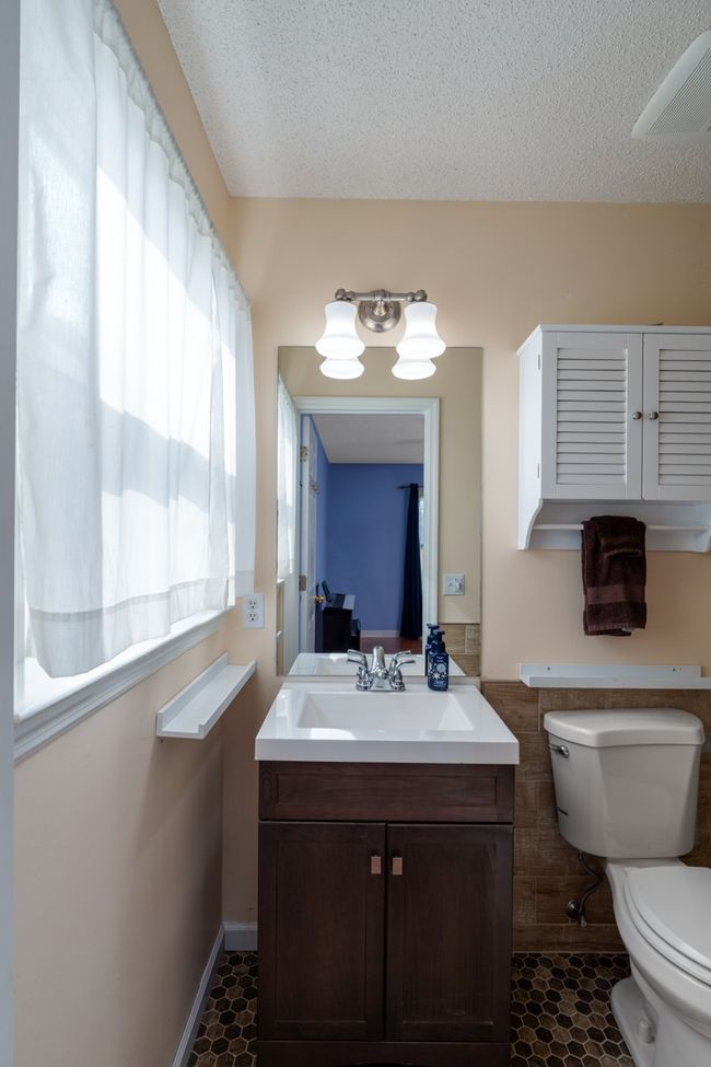 Accessible 2nd bathoom in 2nd primary suite. Built without steps into the shower, and it has safety rails | Image 23