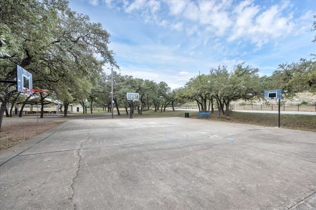 Next to the playground are basketball courts. | Image 12