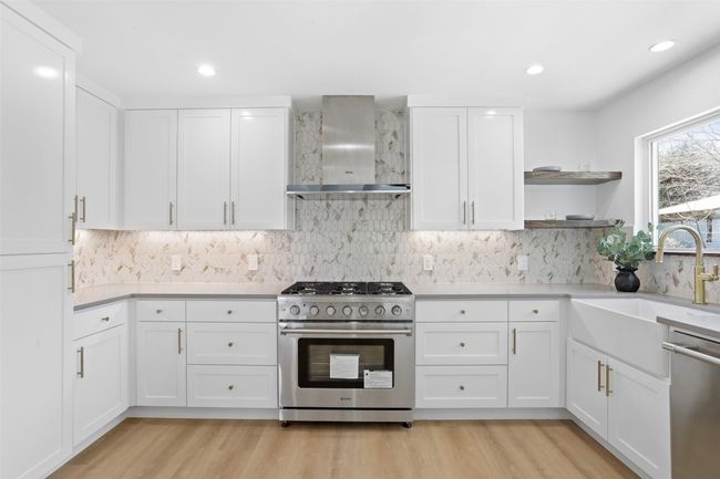 Kitchen featuring custom kitchen cabinetry and stainless steel appliances | Image 11