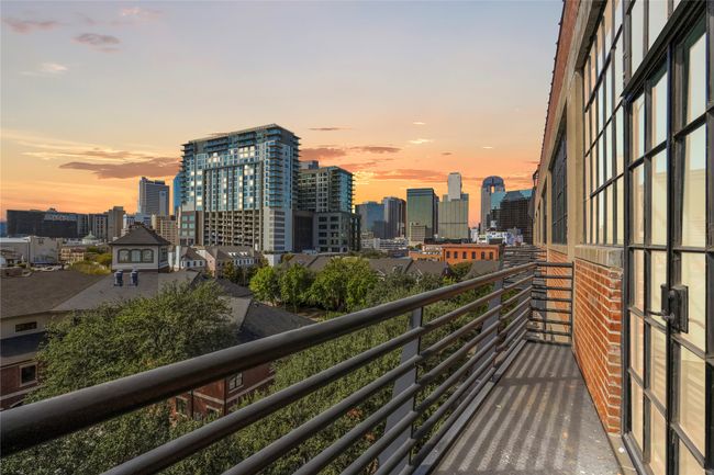 Balcony at dusk with a city view | Image 24