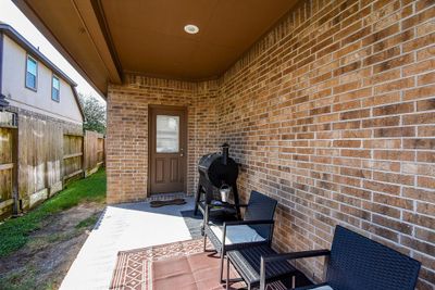 All brick side covered side/back patio. Located off the breakfast room and a perfect place to relax. | Image 3