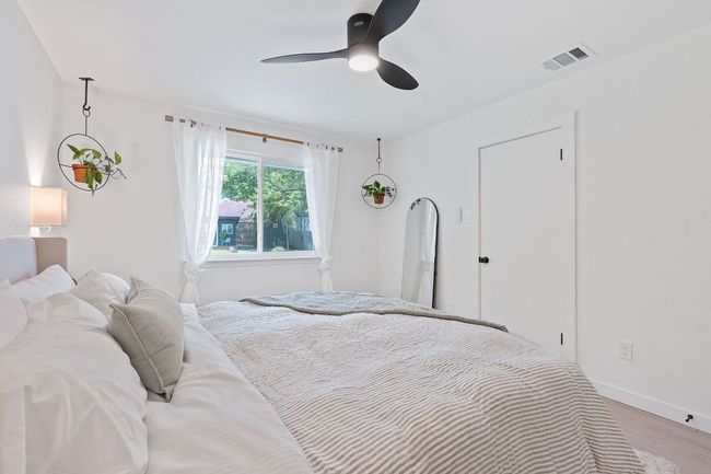 Bedroom featuring wood finished floors and a ceiling fan | Image 19
