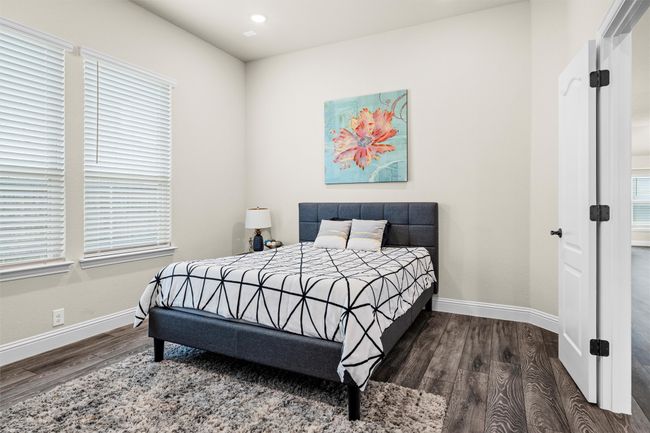 Bedroom featuring wood finished floors and recessed lighting | Image 17
