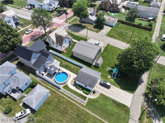 Aerial view of residential area featuring a pool | Image 5