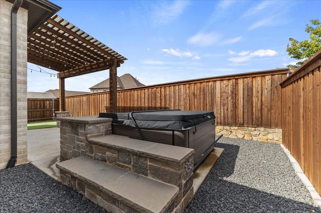 Fenced backyard featuring a hot tub, a patio, and a pergola | Image 34