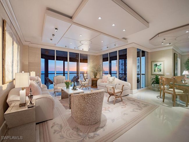 Grand Living area with evening sunset views of the gulf waters and beach with custom recessed lighting, and crown molding. | Image 4