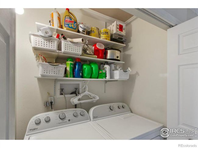 The washing machine was very recently purchased and fits perfectly in the laundry room. | Image 19