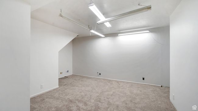 Additional living space featuring carpet floors and attic access | Image 20